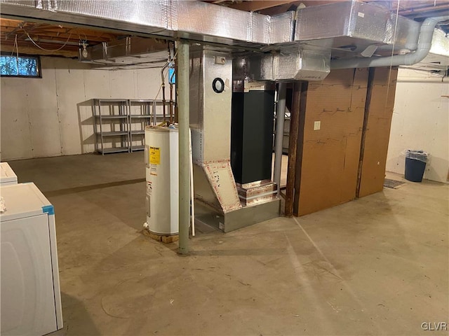 basement featuring electric water heater and washer / clothes dryer