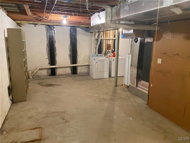 basement featuring washing machine and clothes dryer