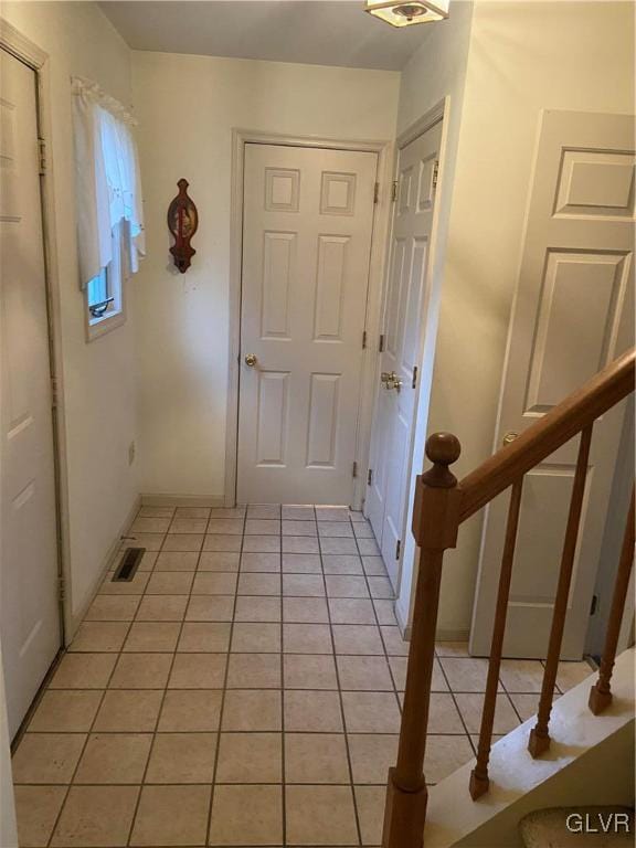 hallway with light tile patterned flooring