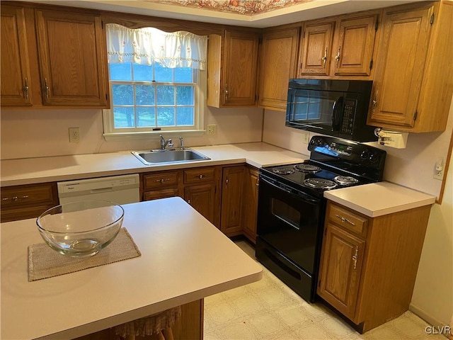 kitchen featuring sink and black appliances