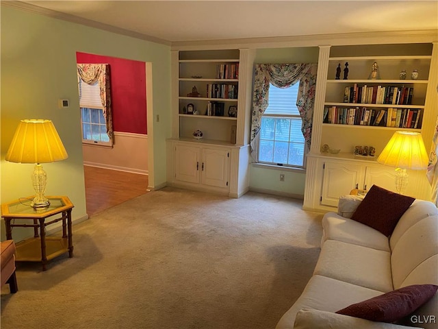 sitting room with light colored carpet and ornamental molding