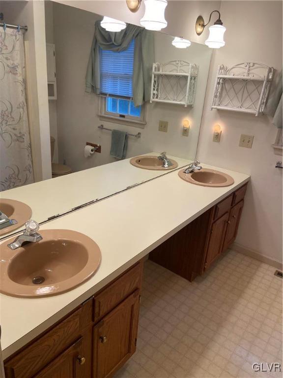 bathroom with vanity and toilet