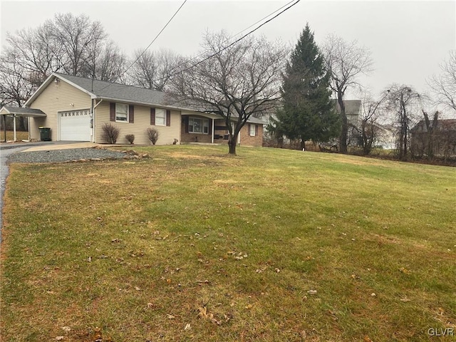 view of yard with a garage and a carport