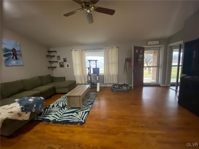 living room with hardwood / wood-style floors and ceiling fan