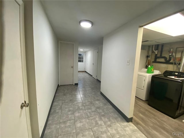 corridor featuring independent washer and dryer