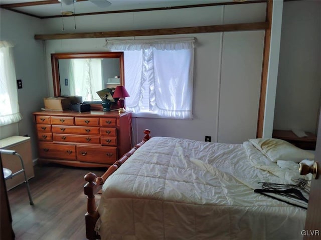 bedroom featuring hardwood / wood-style floors and ceiling fan