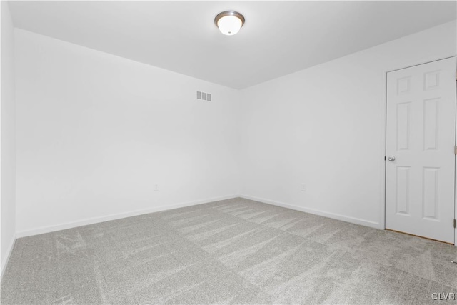 spare room with light carpet