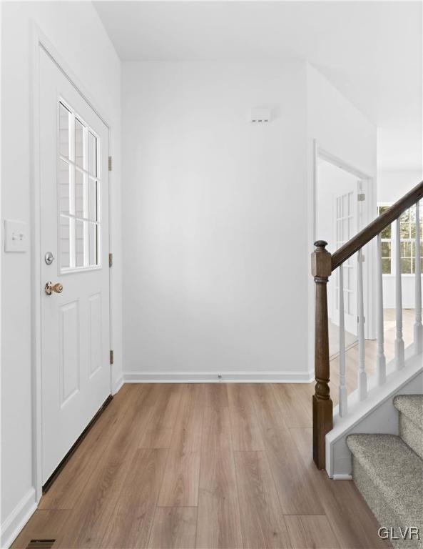 entryway with light hardwood / wood-style flooring