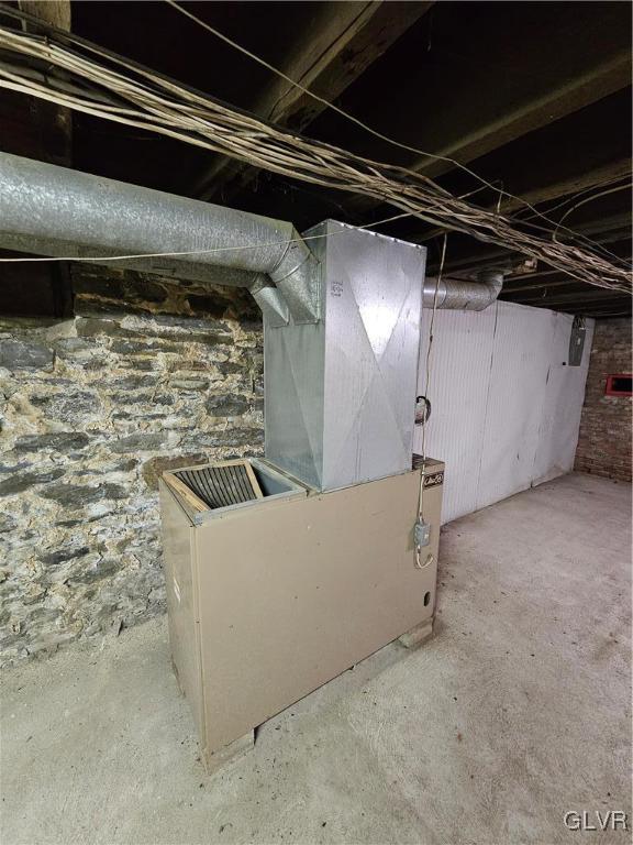 basement featuring heating unit