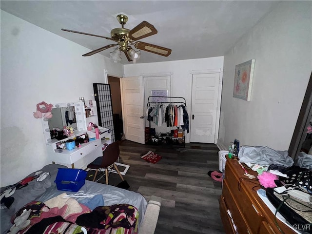 bedroom featuring ceiling fan and dark wood-type flooring