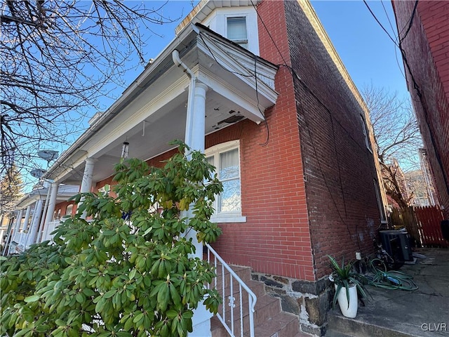 view of side of home featuring central AC unit