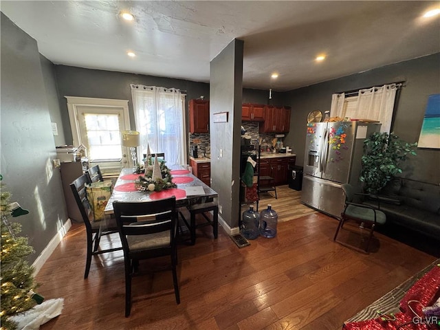 dining room with dark hardwood / wood-style flooring