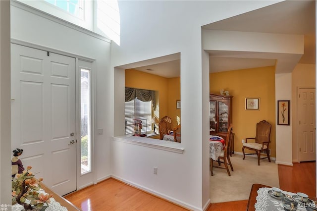 view of carpeted foyer entrance