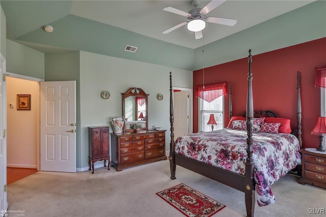 carpeted bedroom with ceiling fan and lofted ceiling