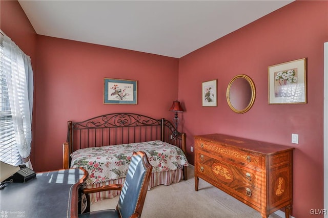 bedroom featuring light carpet