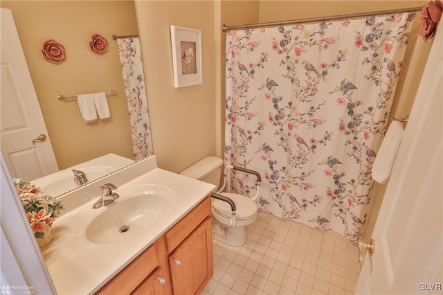 bathroom with tile patterned floors, vanity, and toilet