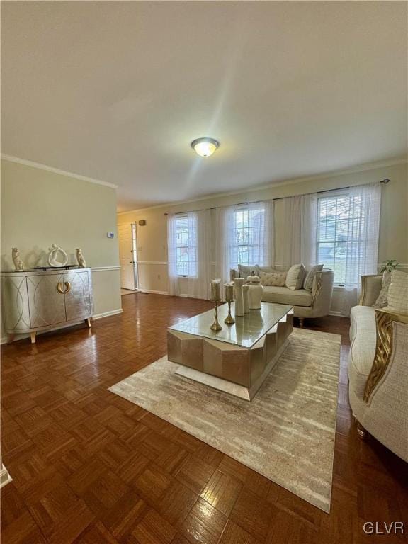 living room featuring crown molding and dark parquet flooring