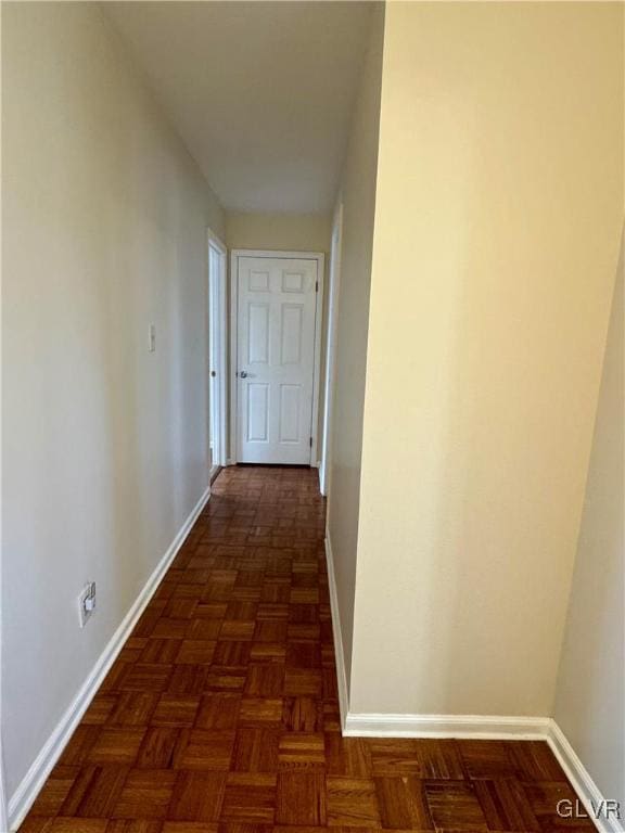 hall with dark parquet flooring