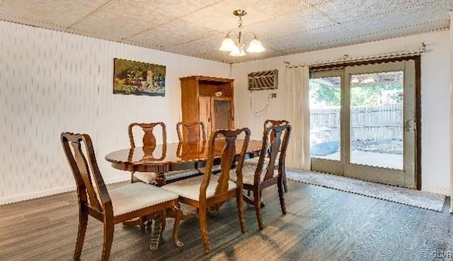 dining space with a chandelier