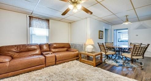 living room featuring a wealth of natural light, ceiling fan, and hardwood / wood-style flooring