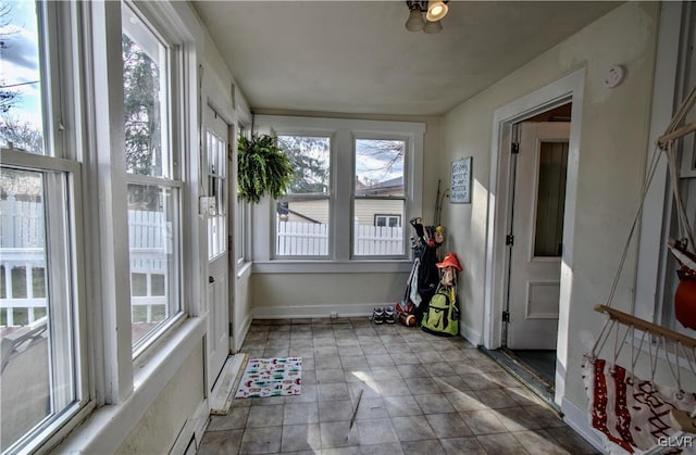 unfurnished sunroom featuring a wealth of natural light