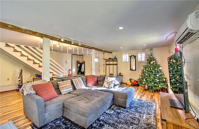 812 Lehigh St, Jim Thorpe Borough, PA 18229 - living room featuring a wall unit AC, stairs, and wood finished floors