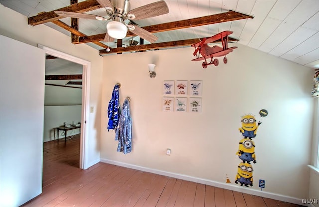 interior space with hardwood / wood-style flooring, vaulted ceiling with beams, and wooden ceiling