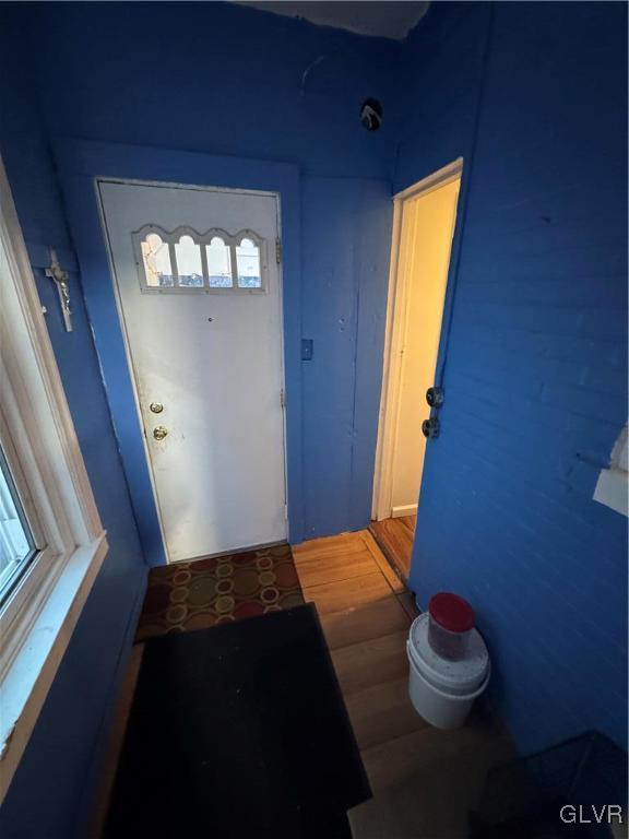 doorway to outside with hardwood / wood-style floors and plenty of natural light