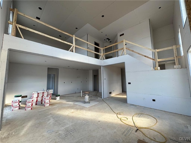 interior space with a towering ceiling