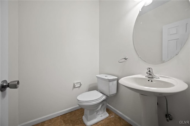 bathroom with tile patterned flooring and toilet