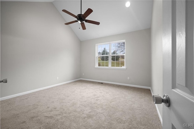 empty room featuring carpet flooring, high vaulted ceiling, and ceiling fan