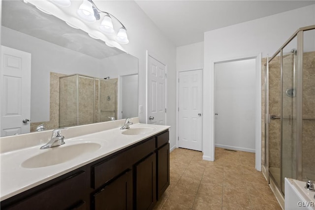 bathroom featuring vanity, tile patterned floors, and an enclosed shower