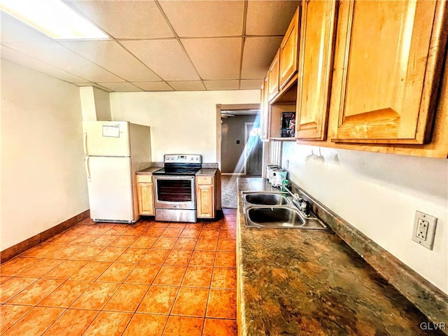 kitchen featuring sink, a drop ceiling, white refrigerator, electric stove, and light tile patterned floors