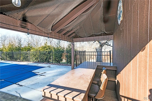 view of patio / terrace with a covered pool