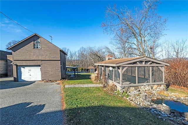 view of home's exterior with an outdoor structure