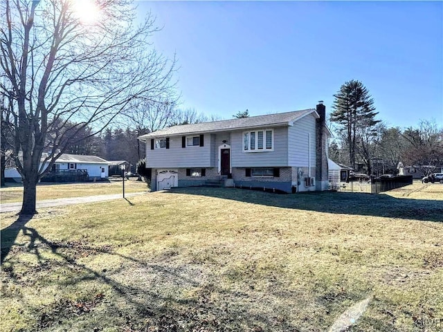 bi-level home featuring a front yard