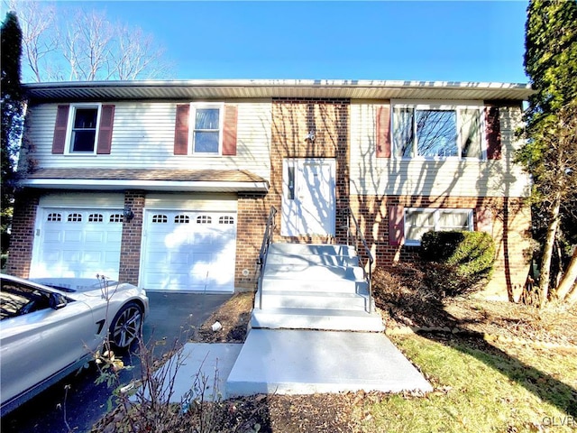 split foyer home featuring a garage