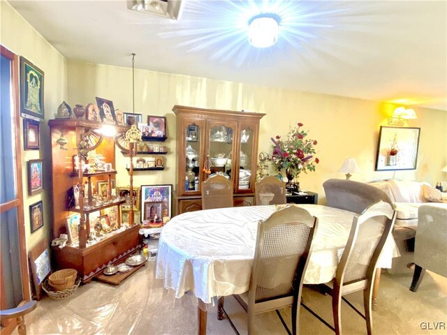 view of carpeted dining area