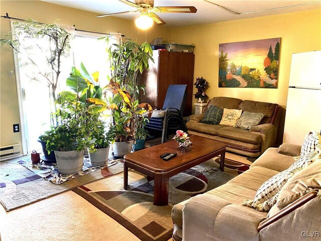 living room with carpet floors and ceiling fan