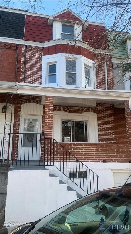 view of snow covered exterior with covered porch