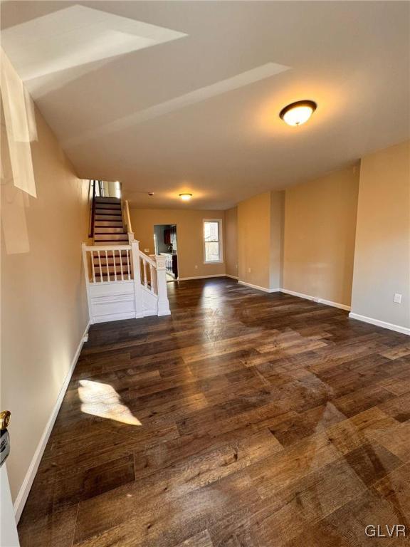 empty room featuring dark wood-type flooring