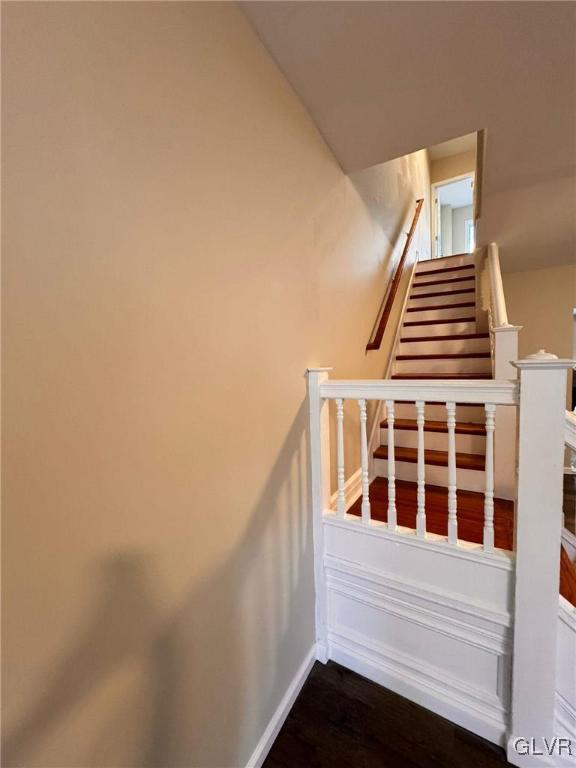 stairs with wood-type flooring