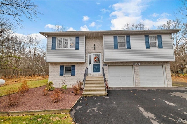 split foyer home featuring a garage