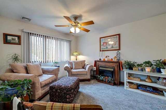 living room with carpet and ceiling fan