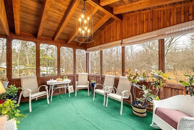 sunroom / solarium with vaulted ceiling with beams, wooden ceiling, and a chandelier