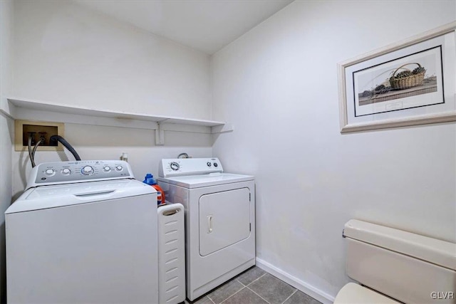 washroom with tile patterned floors and washing machine and clothes dryer