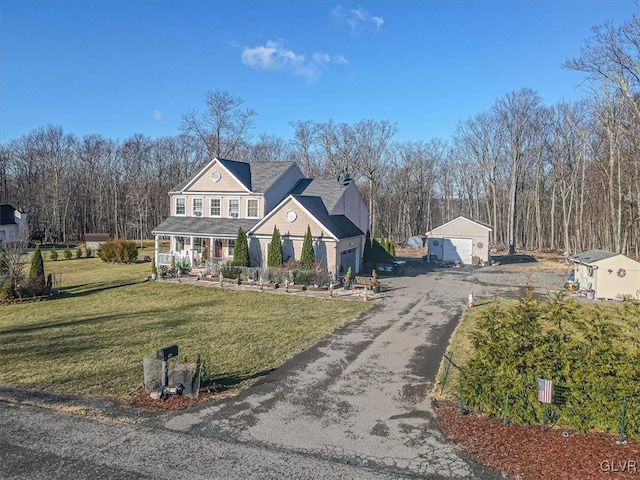 view of front of home with a front yard and covered porch