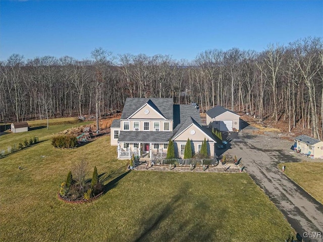 view of front of property with covered porch and a front lawn