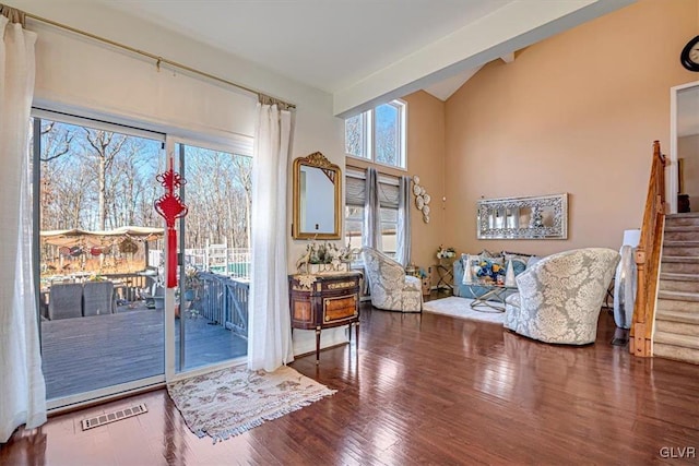 doorway to outside with vaulted ceiling and hardwood / wood-style flooring