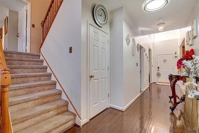 foyer entrance with wood-type flooring